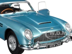 1964 Aston Martin DB5 RHD (Right Hand Drive) Light Blue Metallic 1/18 Diecast Model Car by Solido