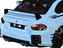 2024 BMW M2 Performance Parts Zandvoort Blue with Carbon Top and Black Stripes 1/18 Diecast Model Car by Solido