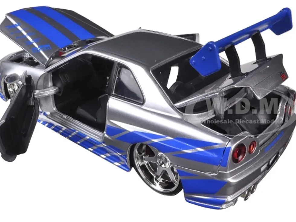 Brian's Nissan GTR Skyline R34 RHD (Right Hand Drive) Silver with Blue Stripes "Fast & Furious 25th Anniversary" Series 1/24 Diecast Model Car by Jada
