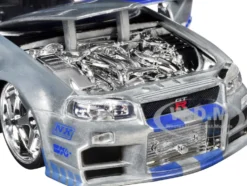 Brian's Nissan Skyline GT-R (R34) RHD (Right Hand Drive) Silver Color Brush Finish with Blue Stripes "2 Fast 2 Furious" (2003) Movie "Fast & Furious" Series 1/24 Diecast Model Car by Jada