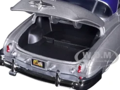 1950 Chevrolet Bel Air Lowrider Silver Metallic Blue Metallic Top Get Low Series 1/24 Diecast Model Car Motormax 79026
