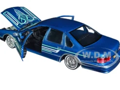 1993 Chevrolet Caprice Lowrider Blue Metallic Graphics Get Low Series 1/24 Diecast Model Car Motormax 79022