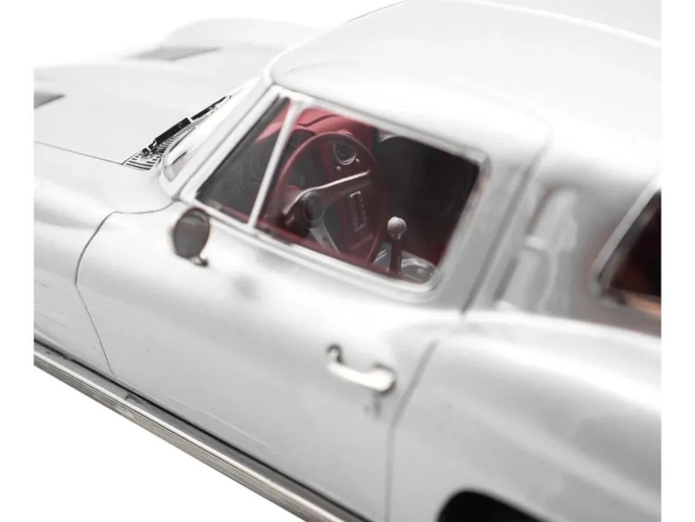 1963 Chevrolet Corvette Sting Ray Sebring Silver Metallic with Red Interior 1/18 Diecast Model Car by Norev