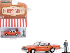 1981 Chevrolet Impala Capitol Cab Taxi Orange with White Top and Man in Suit Figure The Hobby Shop Series 15 1/64 Diecast Model Car Greenlight 97150B
