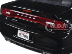 2011 Dodge Charger Pursuit Police Car Black and White with Flashing Light Bar, Front and Rear Lights and 2 Sounds 1/24 Diecast Model Car Motormax 79533