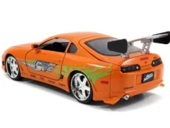 Dom's 1970 Dodge Charger R/T Black and Brian's Toyota Supra Orange with Graphics Set of 2 Cars