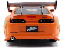 Dom's 1970 Dodge Charger R/T Black and Brian's Toyota Supra Orange with Graphics Set of 2 Cars