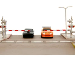 Fast & Furious Final Race Diorama with Toyota Supra Orange and Dodge Charger Black Nano Scene Series model Jada 34915