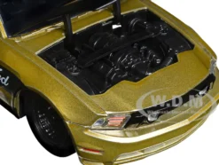 2010 Ford Mustang GT Gold Metallic with Black Graphics and Hood Tom s Racing Bigtime Muscle Series 1/24 Diecast Model Car Jada 33055