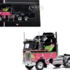 1976 Kenworth K100 Aerodyne Truck Tractor Black and Pink with Graphics 1/64 Diecast Model by IXO Models