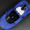 McLaren Elva Convertible #26 Matt Blue with White Stripes Extra Wheels 1/64 Diecast Model Car CM Models CM64-ELVA-01