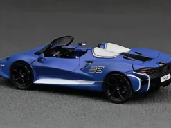 McLaren Elva Convertible #26 Matt Blue with White Stripes Extra Wheels 1/64 Diecast Model Car CM Models CM64-ELVA-01