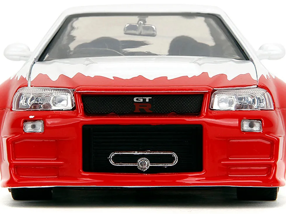 2002 Nissan Skyline GT-R (R34) RHD (Right Hand Drive) White with Red Graphics and Ryu Diecast Figure "Street Fighter" Video Game "Anime Hollywood Rides" Series 1/24 Diecast Model Car by Jada