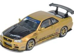 Nissan Skyline GT-R (R34) RHD (Right Hand Drive) "Top Secret" Gold Metallic with Carbon Hood and Trunk 1/64 Diecast Model Car by Inno Models