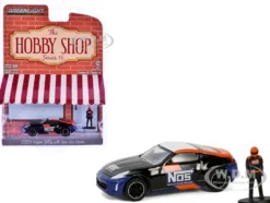 2020 Nissan 370z "NOS Nitrous Oxide Systems" Black with Graphics and Race Car Driver "The Hobby Shop" Series 16 1/64 Diecast Model Car by Greenlight