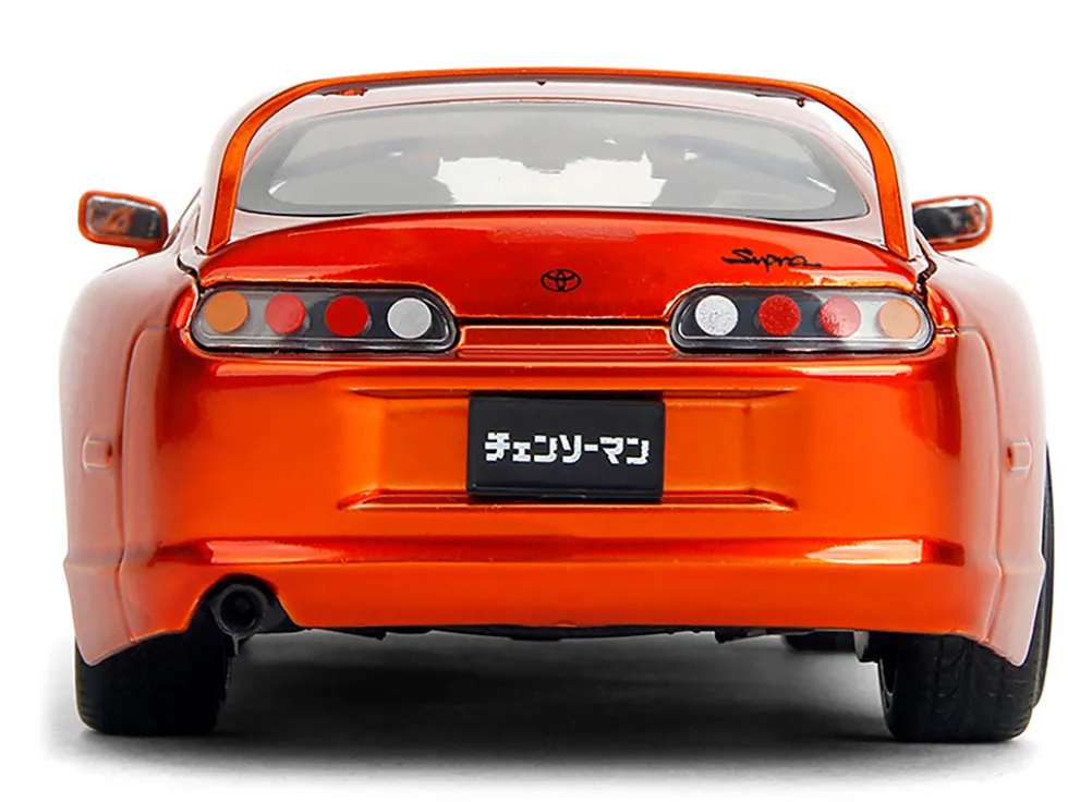 1995 Toyota Supra Orange Metallic with Graphics and Chainsaw Man Diecast Figure "Chainsaw Man" (2022) TV Series "Anime Hollywood Rides" Series 1/24 Diecast Model by Jada